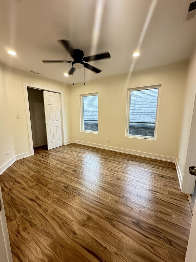 1325 S 50th Ct, Cicero, IL 60804 - unfurnished bedroom with dark wood-style flooring, recessed lighting, ceiling fan, and a closet