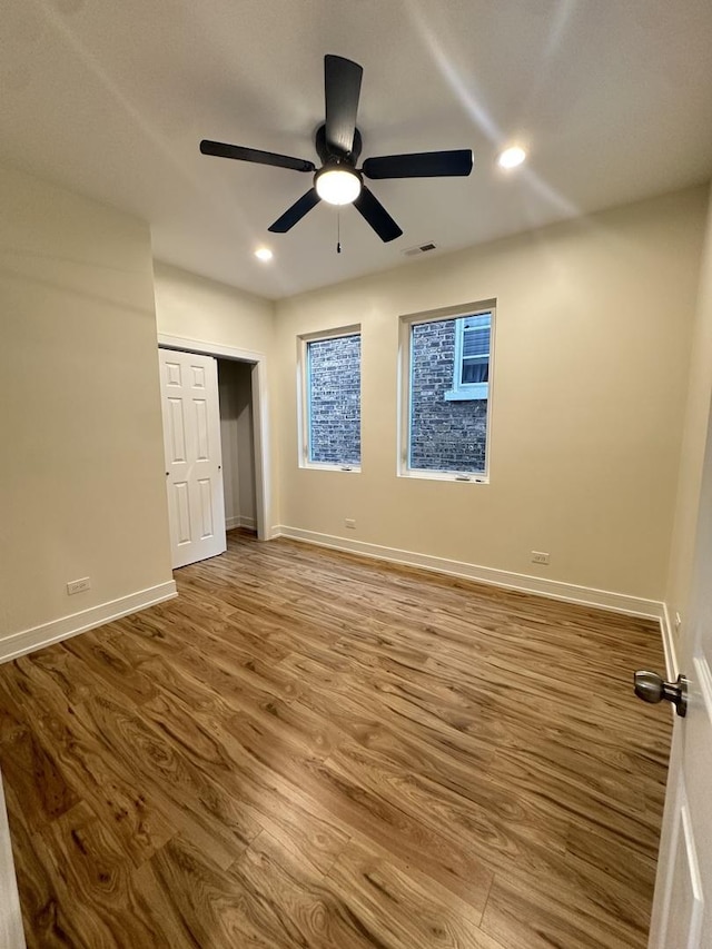 1325 S 50th Ct, Cicero, IL 60804 - unfurnished bedroom with recessed lighting, wood finished floors, ceiling fan, and a closet