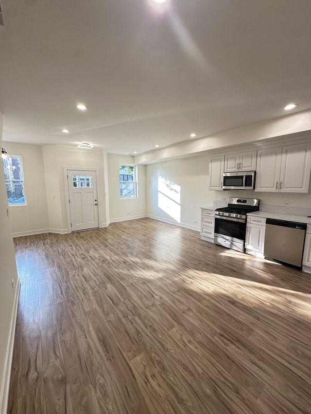 1325 S 50th Ct, Cicero, IL 60804 - unfurnished living room featuring wood finished floors and recessed lighting