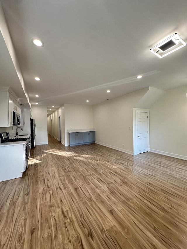 1325 S 50th Ct, Cicero, IL 60804 - unfurnished living room with wood finished floors, recessed lighting, and lofted ceiling