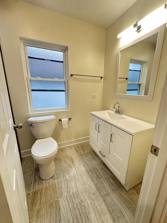 1325 S 50th Ct, Cicero, IL 60804 - half bathroom featuring vanity and baseboards