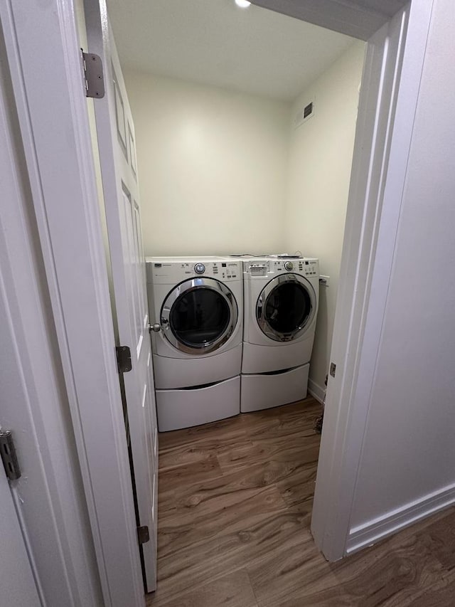 1325 S 50th Ct, Cicero, IL 60804 - washroom featuring washing machine and clothes dryer and wood finished floors