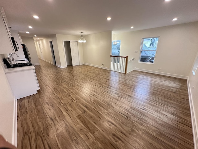 1325 S 50th Ct, Cicero, IL 60804 - unfurnished living room with a chandelier, recessed lighting, and dark wood finished floors