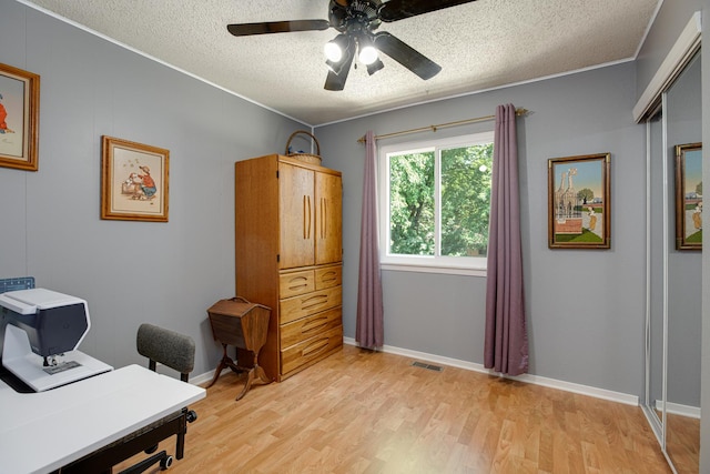 1380 Windjammer Ln, Hanover Park, IL 60133 - office space featuring a textured ceiling, light wood-type flooring, and ceiling fan