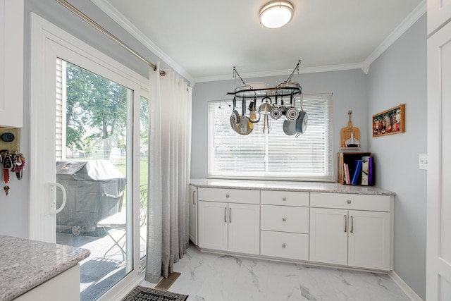 1380 Windjammer Ln, Hanover Park, IL 60133 - dining room featuring plenty of natural light, light marble finish flooring, and crown molding
