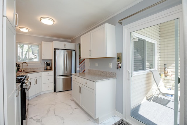 1380 Windjammer Ln, Hanover Park, IL 60133 - kitchen with appliances with stainless steel finishes, ornamental molding, light marble finish floors, white cabinets, and light stone counters