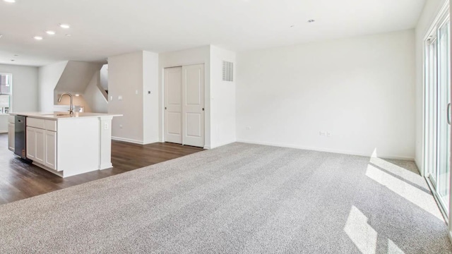 17319 Ulster Dr, Tinley Park, IL 60477 - unfurnished living room featuring dark carpet, plenty of natural light, dark wood-type flooring, and recessed lighting