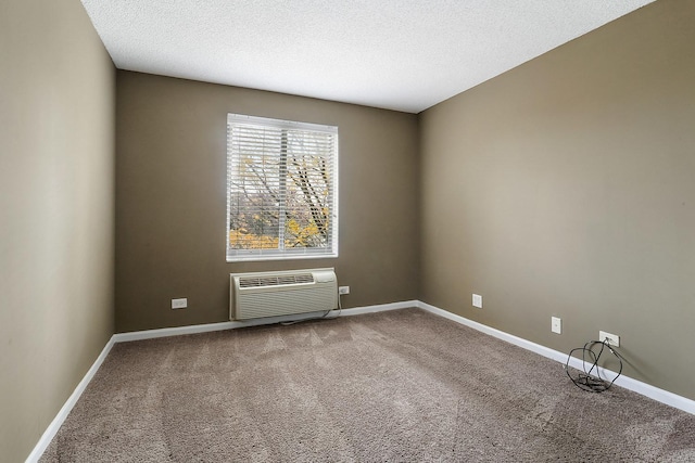 470 Fawell Blvd Unit 320, Glen Ellyn, IL 60137 - carpeted spare room featuring a wall mounted air conditioner and a textured ceiling