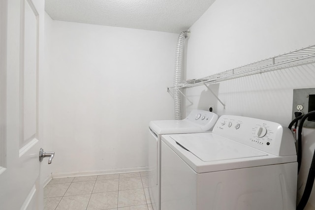 470 Fawell Blvd Unit 320, Glen Ellyn, IL 60137 - washroom with separate washer and dryer, light tile patterned floors, and a textured ceiling