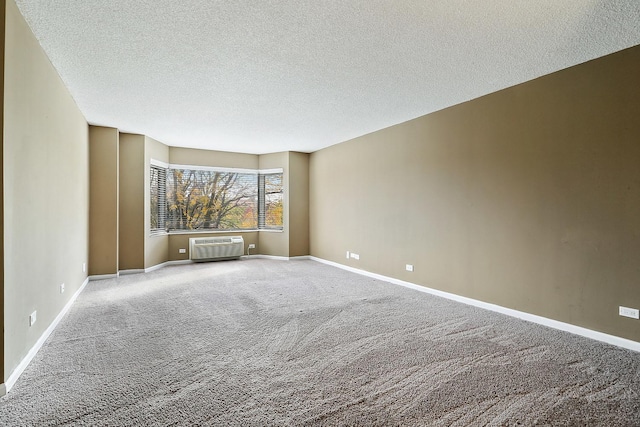 470 Fawell Blvd Unit 320, Glen Ellyn, IL 60137 - spare room with carpet floors, a textured ceiling, and an AC wall unit
