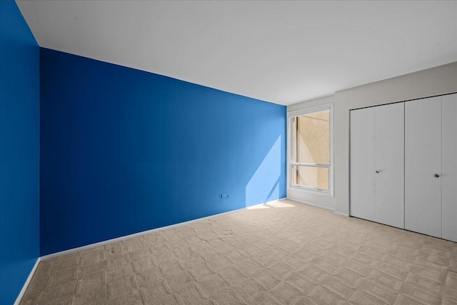 650 Winnetka Mews Unit 311, Winnetka, IL 60093 - unfurnished bedroom featuring carpet and a closet