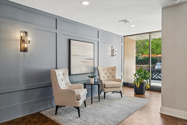 650 Winnetka Mews Unit 311, Winnetka, IL 60093 - sitting room featuring recessed lighting and a decorative wall