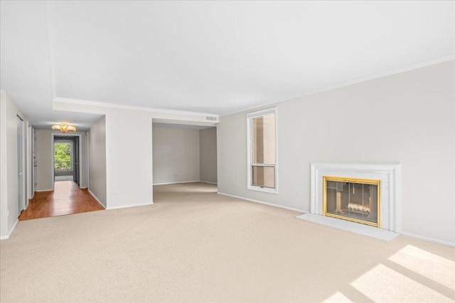 650 Winnetka Mews Unit 311, Winnetka, IL 60093 - unfurnished living room featuring carpet flooring, a glass covered fireplace, and crown molding