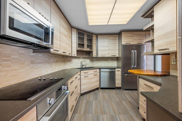 650 Winnetka Mews Unit 311, Winnetka, IL 60093 - kitchen featuring appliances with stainless steel finishes, dark countertops, tasteful backsplash, and open shelves