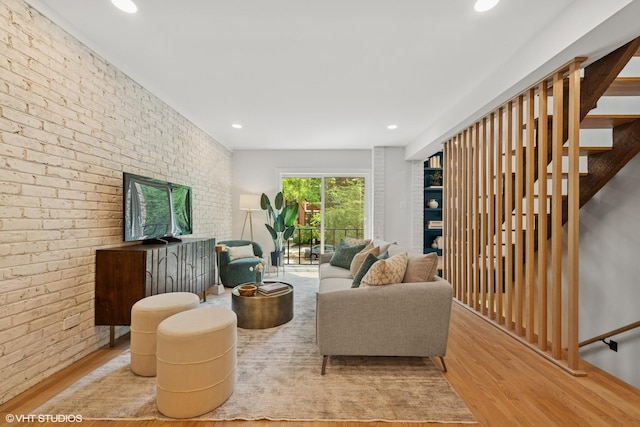 636 W Buckingham Pl Unit C, Chicago, IL 60657 - living area with brick wall, wood finished floors, recessed lighting, and stairway