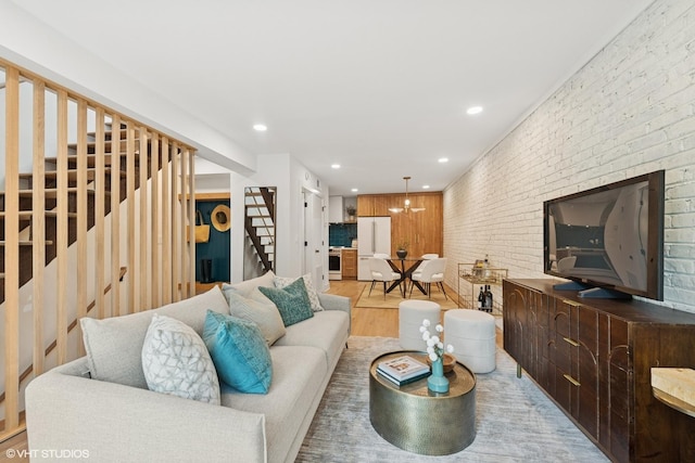 636 W Buckingham Pl Unit C, Chicago, IL 60657 - living room featuring stairs, light wood-type flooring, recessed lighting, and brick wall