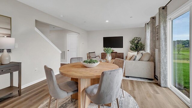 1812 Overland Dr, Plainfield, IL 60586 - dining area featuring light wood-style floors, stairs, and recessed lighting