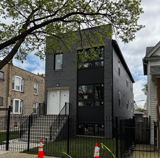 4256 W Augusta Blvd, Chicago, IL 60651 - view of front of home featuring a fenced front yard and brick siding