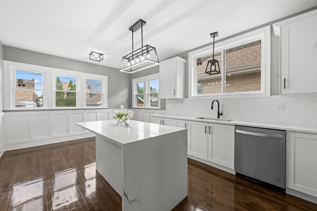 2107 E Ave, Berwyn, IL 60402 - kitchen with dishwasher, light countertops, backsplash, white cabinets, and wainscoting