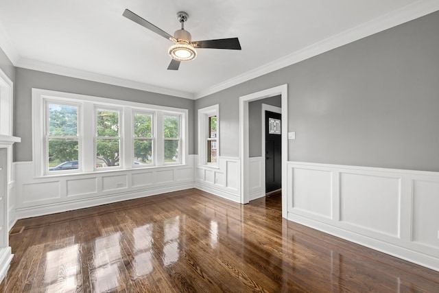 2107 E Ave, Berwyn, IL 60402 - empty room featuring a ceiling fan, wainscoting, wood finished floors, ornamental molding, and a decorative wall