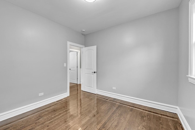 2107 E Ave, Berwyn, IL 60402 - unfurnished room with baseboards and wood finished floors