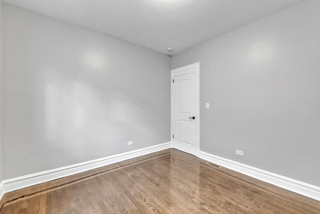 2107 E Ave, Berwyn, IL 60402 - unfurnished room featuring baseboards and wood finished floors