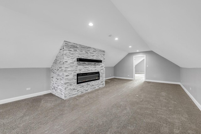2107 E Ave, Berwyn, IL 60402 - unfurnished living room with vaulted ceiling, carpet, recessed lighting, and a fireplace