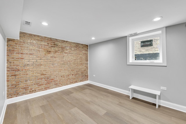 2107 E Ave, Berwyn, IL 60402 - spare room with brick wall, wood finished floors, and recessed lighting