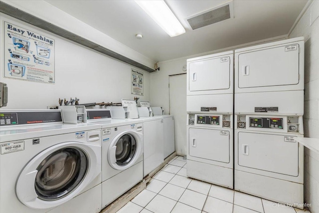 1227 S Harlem Ave Unit 514, Berwyn, IL 60402 - community laundry room featuring stacked washer / drying machine, washer and dryer, and light tile patterned floors