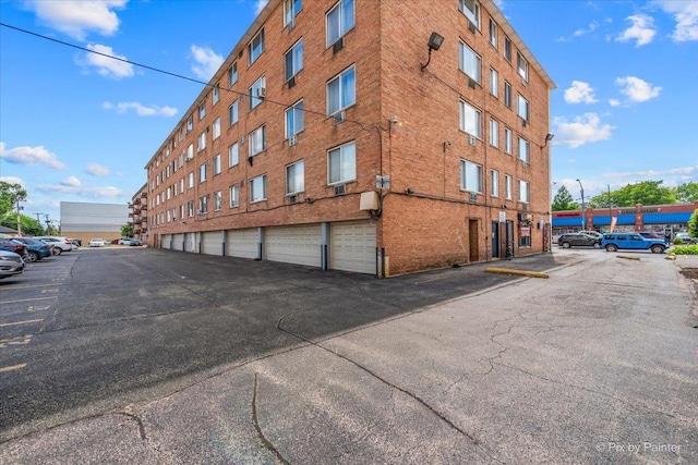 1227 S Harlem Ave Unit 514, Berwyn, IL 60402 - view of building exterior featuring uncovered parking
