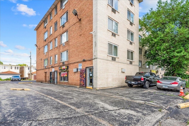 1227 S Harlem Ave Unit 514, Berwyn, IL 60402 - view of building exterior featuring uncovered parking