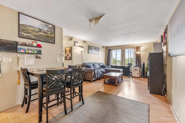 1227 S Harlem Ave Unit 514, Berwyn, IL 60402 - dining area with light wood finished floors