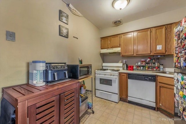 1227 S Harlem Ave Unit 514, Berwyn, IL 60402 - kitchen featuring white appliances, under cabinet range hood, light countertops, brown cabinetry, and light floors