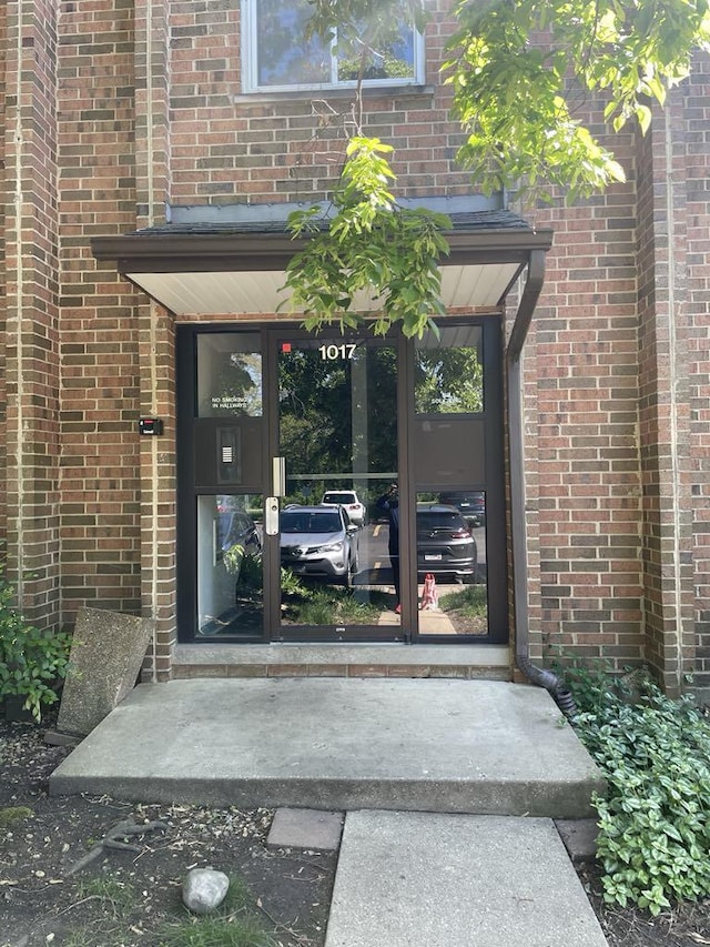 1017 Buccaneer Dr Unit 5, Schaumburg, IL 60173 - view of exterior entry featuring brick siding