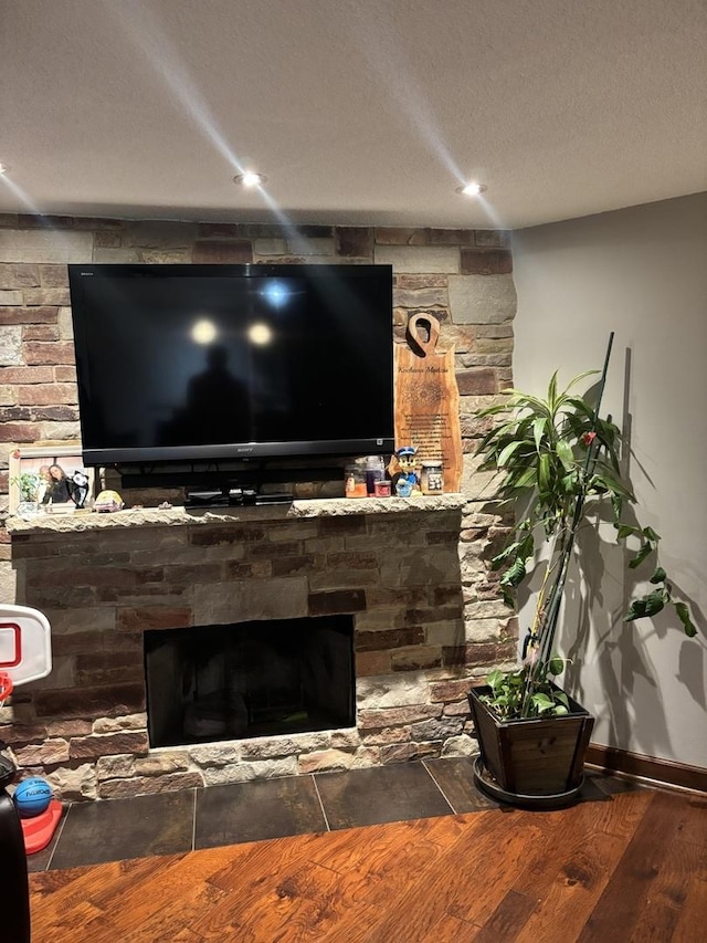 1017 Buccaneer Dr Unit 5, Schaumburg, IL 60173 - detailed view of a fireplace, wood finished floors, and a textured ceiling