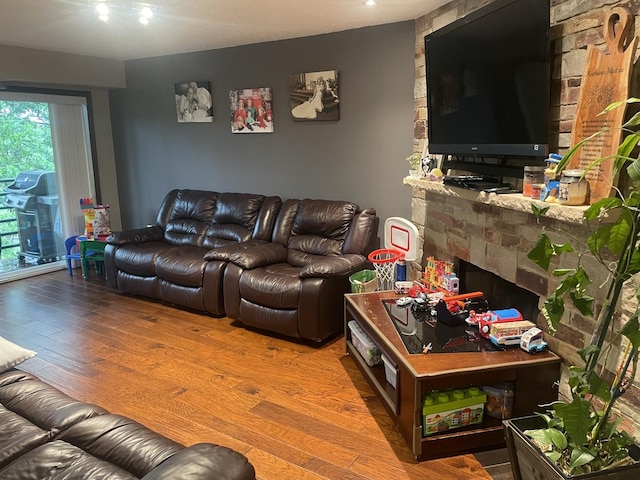1017 Buccaneer Dr Unit 5, Schaumburg, IL 60173 - living room with wood finished floors and a fireplace