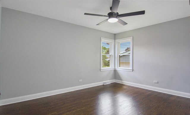 10012 S 52nd Ave, Oak Lawn, IL 60453 - spare room featuring a ceiling fan and dark wood-style flooring