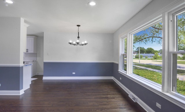10012 S 52nd Ave, Oak Lawn, IL 60453 - unfurnished dining area with healthy amount of natural light, a chandelier, dark wood-type flooring, and recessed lighting