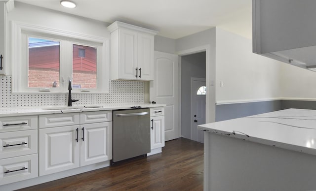 10012 S 52nd Ave, Oak Lawn, IL 60453 - kitchen featuring stainless steel dishwasher, dark wood finished floors, white cabinets, light countertops, and tasteful backsplash