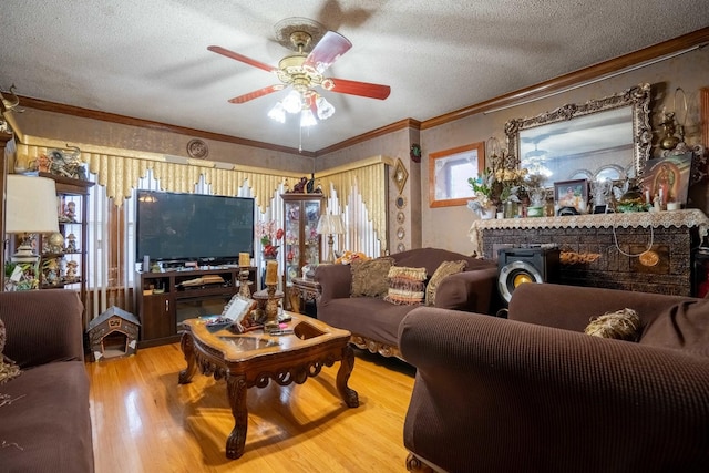4830 W Oakdale Ave, Chicago, IL 60641 - living room with wood finished floors, a textured ceiling, ornamental molding, and a ceiling fan