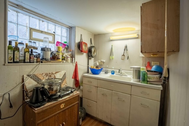 4830 W Oakdale Ave, Chicago, IL 60641 - kitchen featuring light countertops and wood finished floors