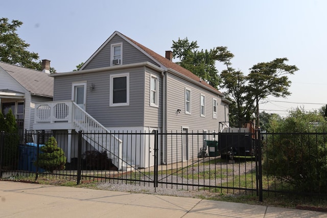 15239 Vincennes Rd, Phoenix, IL 60426 - view of front of home featuring a fenced front yard and a chimney