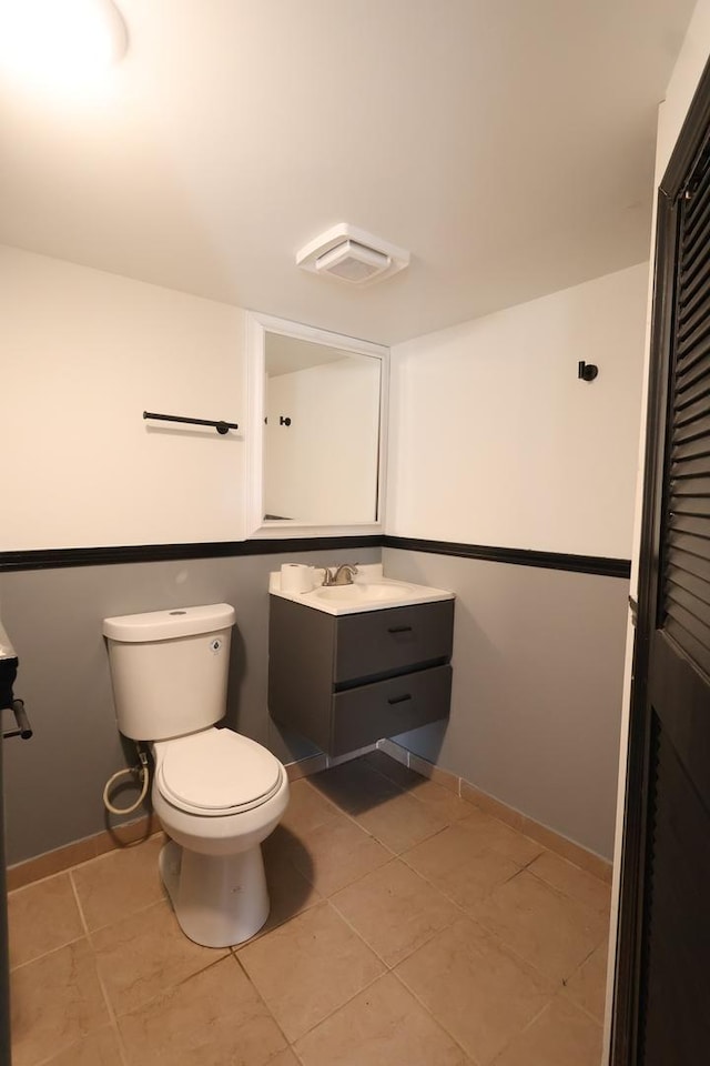 15239 Vincennes Rd, Phoenix, IL 60426 - half bathroom with vanity and tile patterned flooring