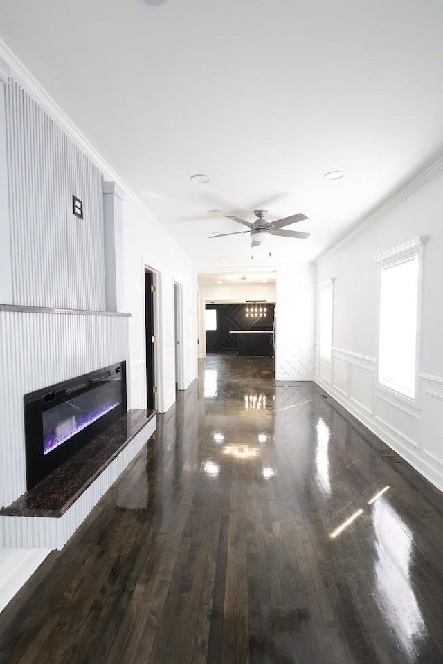 15239 Vincennes Rd, Phoenix, IL 60426 - unfurnished living room featuring a glass covered fireplace, wood finished floors, ornamental molding, ceiling fan, and wainscoting