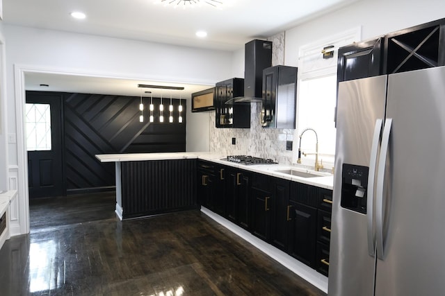 15239 Vincennes Rd, Phoenix, IL 60426 - kitchen featuring appliances with stainless steel finishes, wall chimney exhaust hood, dark cabinets, a peninsula, and recessed lighting