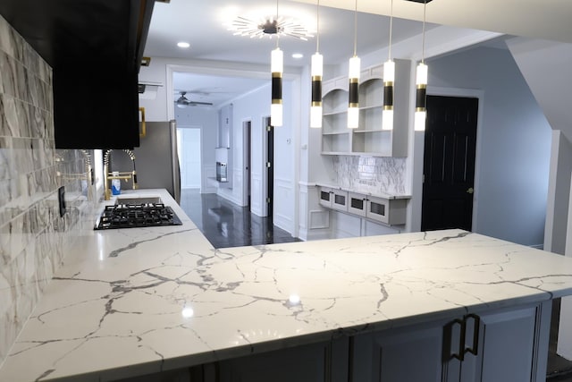 15239 Vincennes Rd, Phoenix, IL 60426 - kitchen with black gas stovetop, backsplash, light stone countertops, and recessed lighting