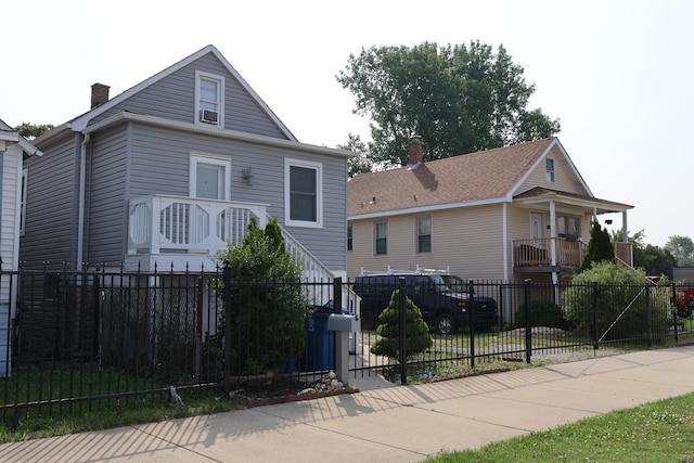 15239 Vincennes Rd, Phoenix, IL 60426 - view of front of property featuring a chimney and a fenced front yard