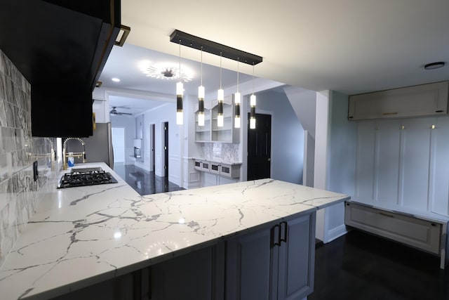 15239 Vincennes Rd, Phoenix, IL 60426 - kitchen with decorative backsplash, light stone countertops, ceiling fan, and black gas cooktop