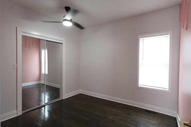 15239 Vincennes Rd, Phoenix, IL 60426 - unfurnished bedroom with dark wood finished floors, a closet, and ceiling fan