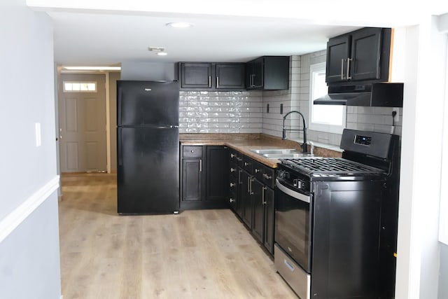 15239 Vincennes Rd, Phoenix, IL 60426 - kitchen featuring black appliances, under cabinet range hood, backsplash, and light wood-type flooring